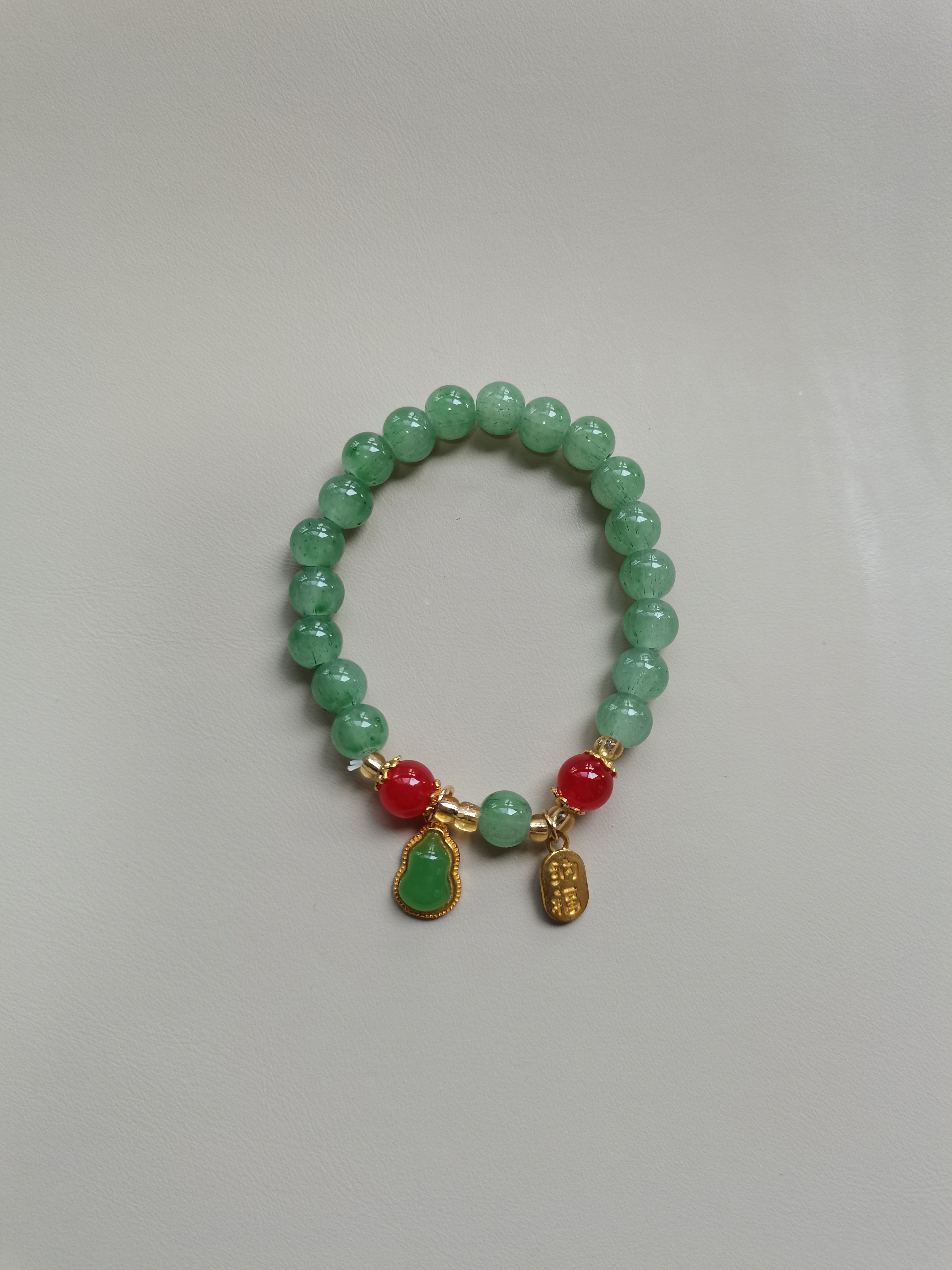 Green Beaded Bracelet with Gourd and 'Fu' Charm