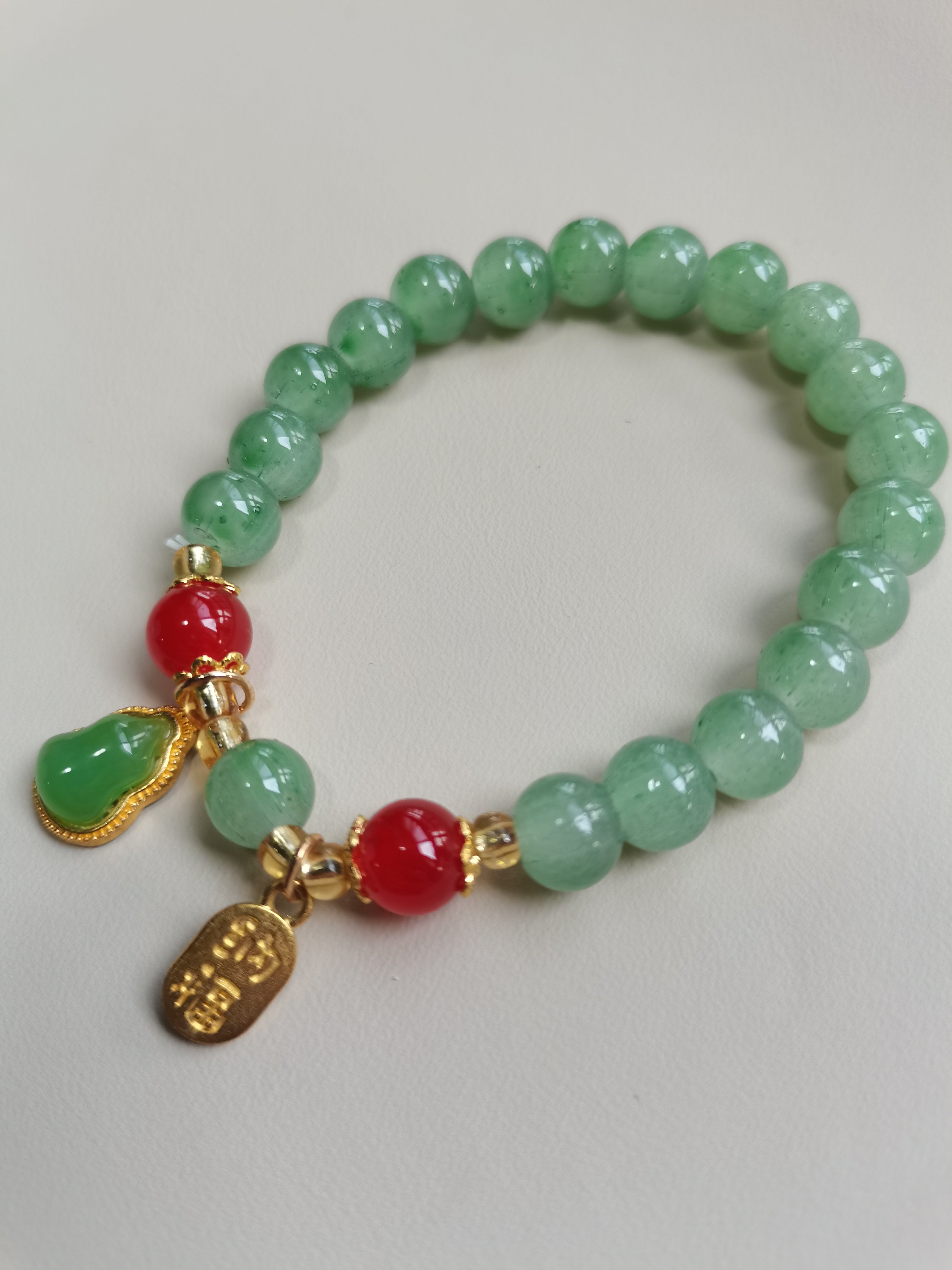 Green Beaded Bracelet with Gourd and 'Fu' Charm